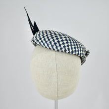 Load image into Gallery viewer, Short brimmed perching cap made in navy and white buntal straw with feathers.  Rear view.