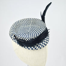 Load image into Gallery viewer, Short brimmed perching cap made in navy and white buntal straw with feathers. 3/4 view