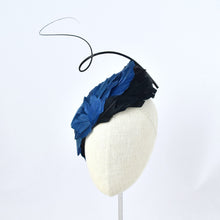 Load image into Gallery viewer, Tear dropped shape percher with peacock blue and black feathers with a dramatic curled quill.  Front view.