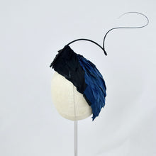 Load image into Gallery viewer, Tear dropped shape percher with peacock blue and black feathers with a dramatic curled quill.  Back view.