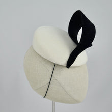 Load image into Gallery viewer, White velour felt percher with a black velour felt swirl trim. Side view.
