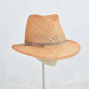 Fedora in peach colored knotted sisal.  3/4 front view.