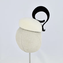 Load image into Gallery viewer, White velour felt percher with a black velour felt swirl trim. Back view.