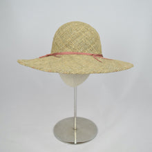 Load image into Gallery viewer, Made from seagrass, this wide brim hat will protect you from the sun.
