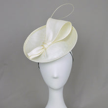 Load image into Gallery viewer, Front view of white saucer hat with bow and quill

