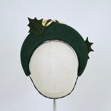 Load image into Gallery viewer, Forest green headband with felt trim and metal leaf, back view
