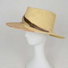 Load image into Gallery viewer, Straw Hat with woven design and feathers viewed from the left side
