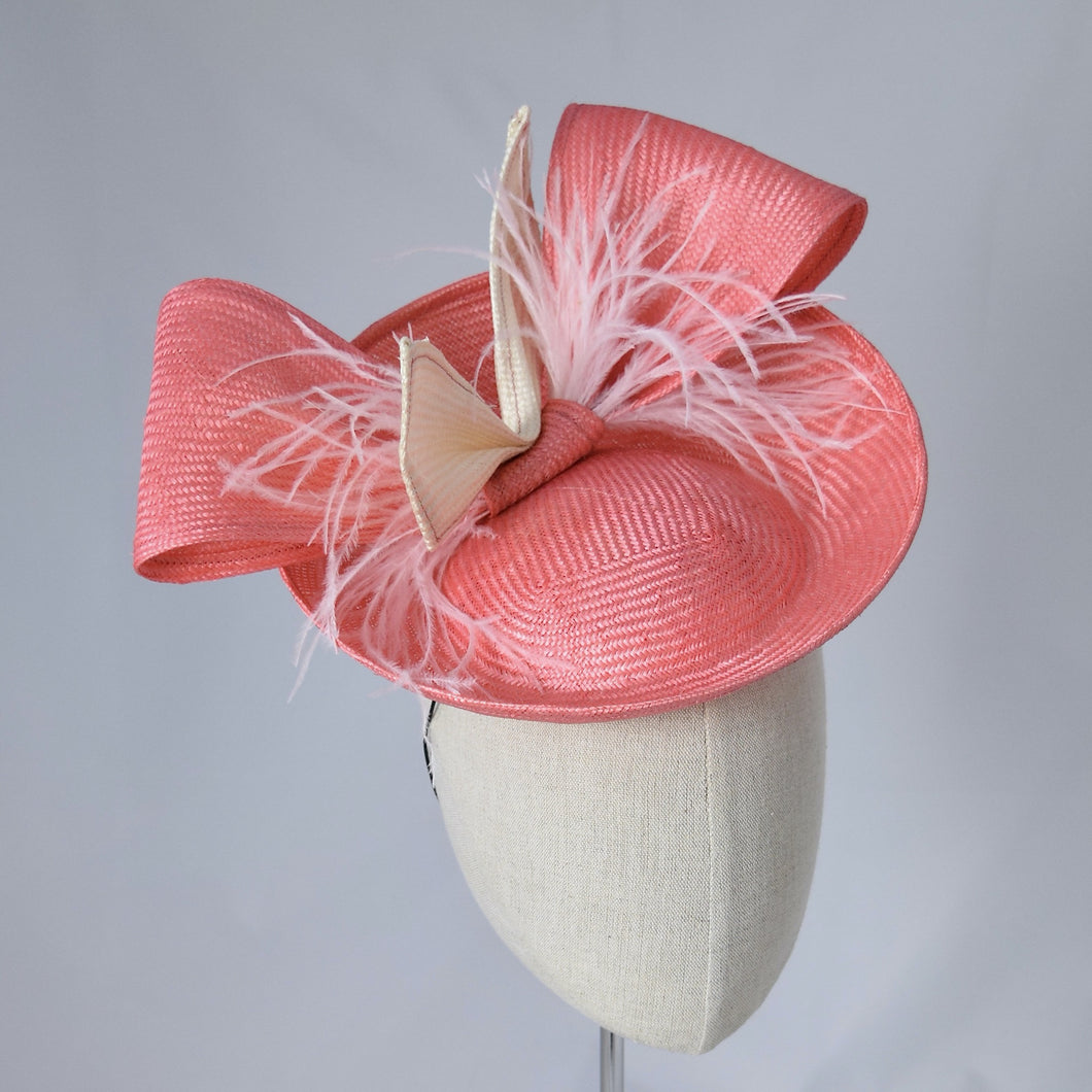 Peachy pink parisisal saucer with self bow and feathers. 