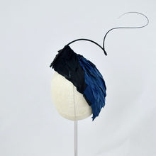 Load image into Gallery viewer, Tear dropped shape percher with peacock blue and black feathers with a dramatic curled quill.  Back view.

