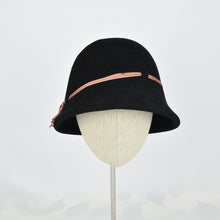 Load image into Gallery viewer, Black fur felt with narrow coral colored ribbon in a classic cloche style. Front view.
