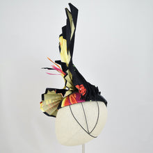 Load image into Gallery viewer, Pleated silk on yellow sinamay with feather and sinamay trim.  Side view. The elastic and the wire prong will disappear in your hair.
