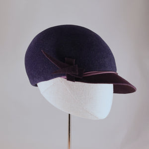 Indigo velour felt cap with violet visor. Side view.