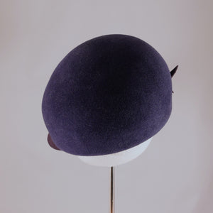 Indigo velour felt cap with violet visor.  Back view.