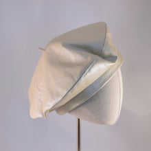 Load image into Gallery viewer, Classic beret in oyster colored leather.  Side view.
