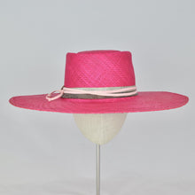 Load image into Gallery viewer, Shocking pink panama straw with a telescope crown and wide, flat brim. Front view.
