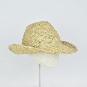 Seagrass straw in a modified cowboy look with removable hand dyed ribbon.  3/4 front view without ribbon.