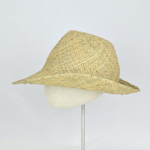 Seagrass straw in a modified cowboy look with removable hand dyed ribbon. Side view without ribbon.