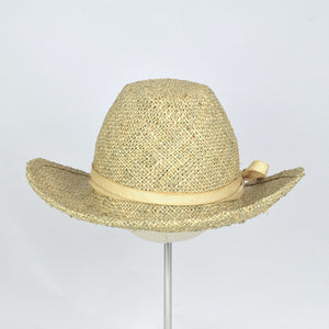 Seagrass straw in a modified cowboy look with removable hand dyed ribbon. Back view.