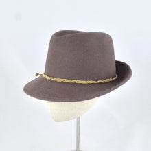 Load image into Gallery viewer, Taupe velour fur felt in a classic trilby style crown and snap brim. Side view.
