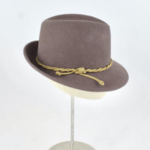 Load image into Gallery viewer, Taupe velour fur felt in a classic trilby style crown and snap brim. Side view.
