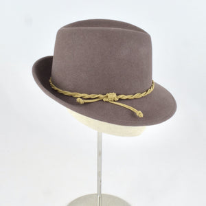 Taupe velour fur felt in a classic trilby style crown and snap brim. Side view.