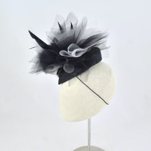 Load image into Gallery viewer, Black sinamay tear drop percher with black and grey tulle, black sculpted feathers, and vintage leather buckle. Side view.
