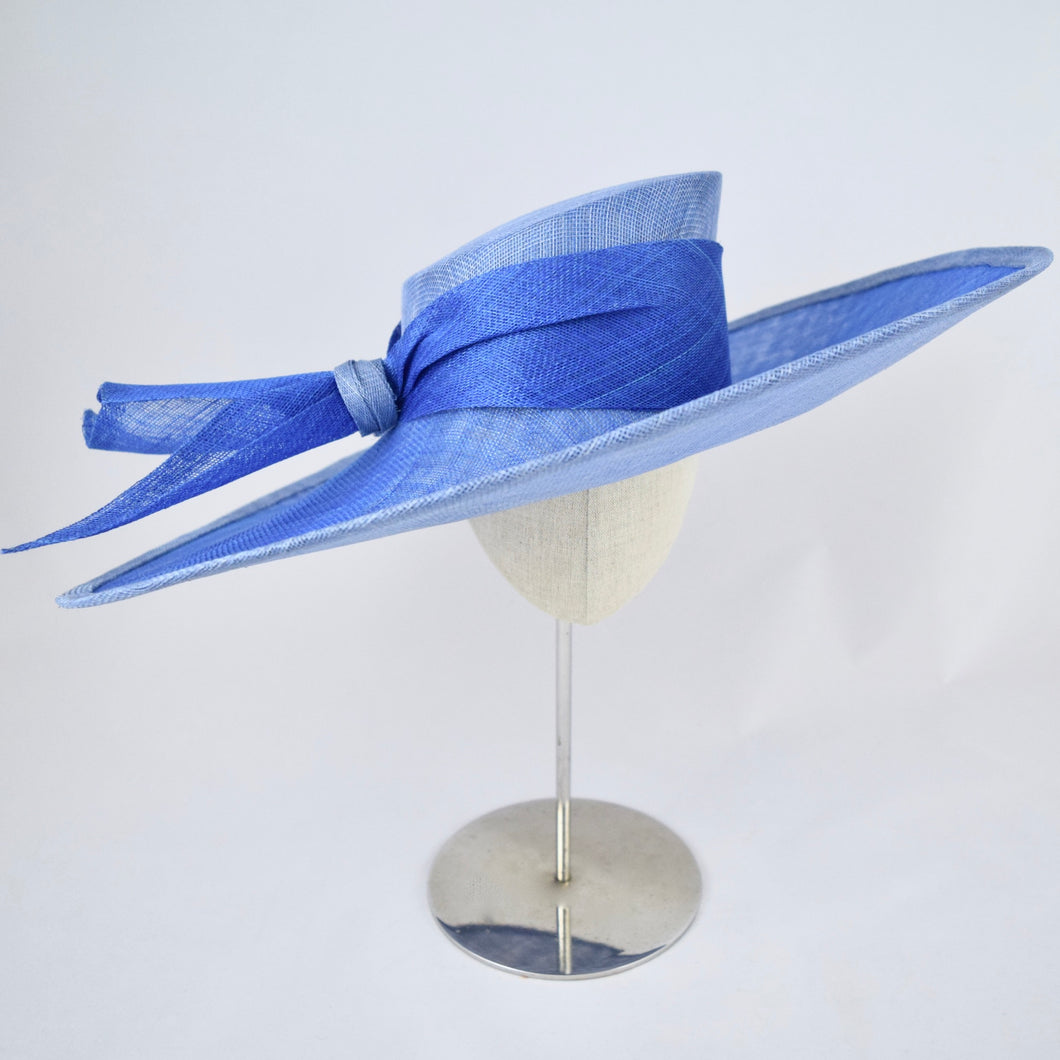 Two-tone wide brim blue sinamay hat. Front view.