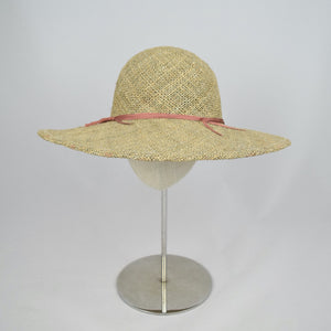 Made from seagrass, this wide brim hat will protect you from the sun.